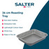 Grey non-stick baking trays shown with roasted chicken, potatoes, and cookies
