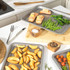 Set of silver non-stick oven trays and racks on kitchen counter