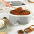 Grey Salter slow cooker control panel with timer dial showing heat settings