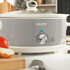 Grey Salter slow cooker with glass lid and dial control, shown at angle.