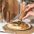 Set of two Salter wood salt and pepper mills on kitchen shelf