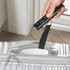 Hand-held digital luggage scale weighing silver suitcase