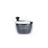 White and black salad spinner with see-through bowl, shown from the side