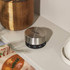 Salter silver kitchen timer in use on shelf beside wooden grinders