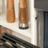 Salter silver kitchen timer in use on shelf beside wooden grinders