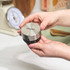 Silver kitchen timer with black dial, shown on worktop for product listing