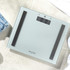 Glass bathroom scale with digital display, silver finish, Salter branding visible.