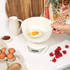 Boxed Salter dual pour bowl scale, white, showing strawberries in bowl.