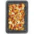 Roasted baby potatoes on tray with feta cheese and red chilli slices
