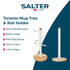 White Salter electric kettle with wooden handle next to cream ceramic mugs on stand