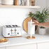White and wood mug tree holder on kitchen counter
