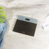 Silver digital bathroom scale with clear display, shown on wooden floor