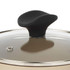 Close up of black knob on glass saucepan lid