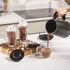Black electric milk frother with handle, Salter branding visible, product image