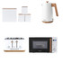 White kitchen set with kettle, toaster, microwave and storage canisters, wood accents