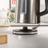 Stainless steel electric kettle base on kitchen counter, Salter logo visible