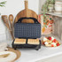 Square waffle maker in black on kitchen worktop, with cooked waffles served