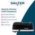 Black electric knife sharpener with Salter branding, shown at angle, 2-year guarantee badge