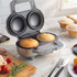 Silver electric pie maker with two golden pies, shown on kitchen counter