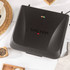 Black Salter sandwich maker closed, showing lid with indicator lights, top-down view