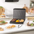 Black Salter sandwich maker closed, showing lid with indicator lights, top-down view