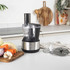Black and stainless steel blender base, front view, power cord attached