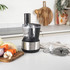 Black and stainless steel blender base, front view, power cord attached