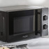 Black Salter microwave oven with two control dials, side view on kitchen counter