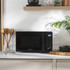 Black countertop microwave oven with digital display, Salter branding, front view.