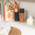 Salter black and wood salt and pepper mills set on a kitchen shelf