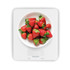 White digital kitchen scale with a bowl of fresh strawberries on display