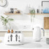 White four-slice toaster with chrome controls on kitchen counter