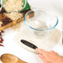 Stone coloured digital kitchen scale with Salter logo, shown angled on white background