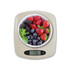 Digital kitchen scale in stone colour with bowl of mixed berries, showing weight 176g