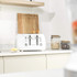 White Salter toaster with two slices of bread in a modern kitchen setting
