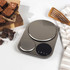 Silver digital kitchen scale with bowl of rice and saffron display, top view