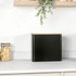 Black metal square bread bin with wooden lid on kitchen worktop