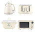 Set of cream kitchen appliances: four-slice toaster, kettle, microwave, and slow cooker