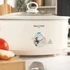 Cream Salter slow cooker on kitchen counter, cooking chilli, hand lifting glass lid