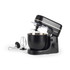 Black stand mixer with stainless steel bowl, shown with whisk, dough hook and beater attachments