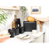 Black bread bin with loaf of bread, modern kitchen setting