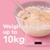 Pink digital kitchen scale with flaked almonds, shown for baking or cooking