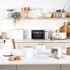 White and wood kitchen set with kettle, toaster, microwave, and storage canisters on worktop