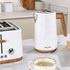 White electric kettle with wood effect handle, shown on kitchen counter.