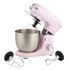 Pink stand mixer with stainless steel bowl and three attachments displayed