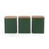 Set of three green metal storage canisters with wooden lids, frontal view
