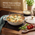 Cream casserole dish with vegetable and chorizo rice on stove, hand stirring with wooden spoon