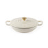 Cream cast iron casserole dish with gold knob and handles, lid on, by Salter