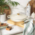 Cream oval casserole dish viewed from above, showing two side handles.
