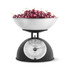 Kitchen scale with bowl holding fresh cherries, shown from the front.